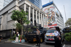  A police officer is seen at his post on Feb. 4 in front of the Constitutional Court building in Jakarta.