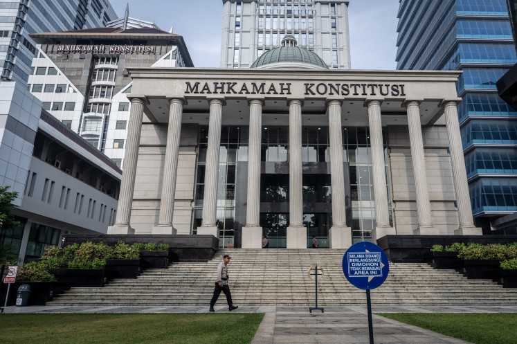 A police officer walks in front of the Constitutional Court building on Feb. 4, 2025, in Jakarta.