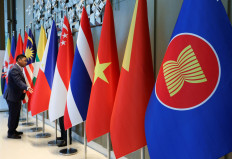 The ASEAN flag (right) is placed alongside the flags of its member countries ahead of the ASEAN Foreign Ministers' Retreat in Langkawi, Malaysia on Jan. 17, 2025.