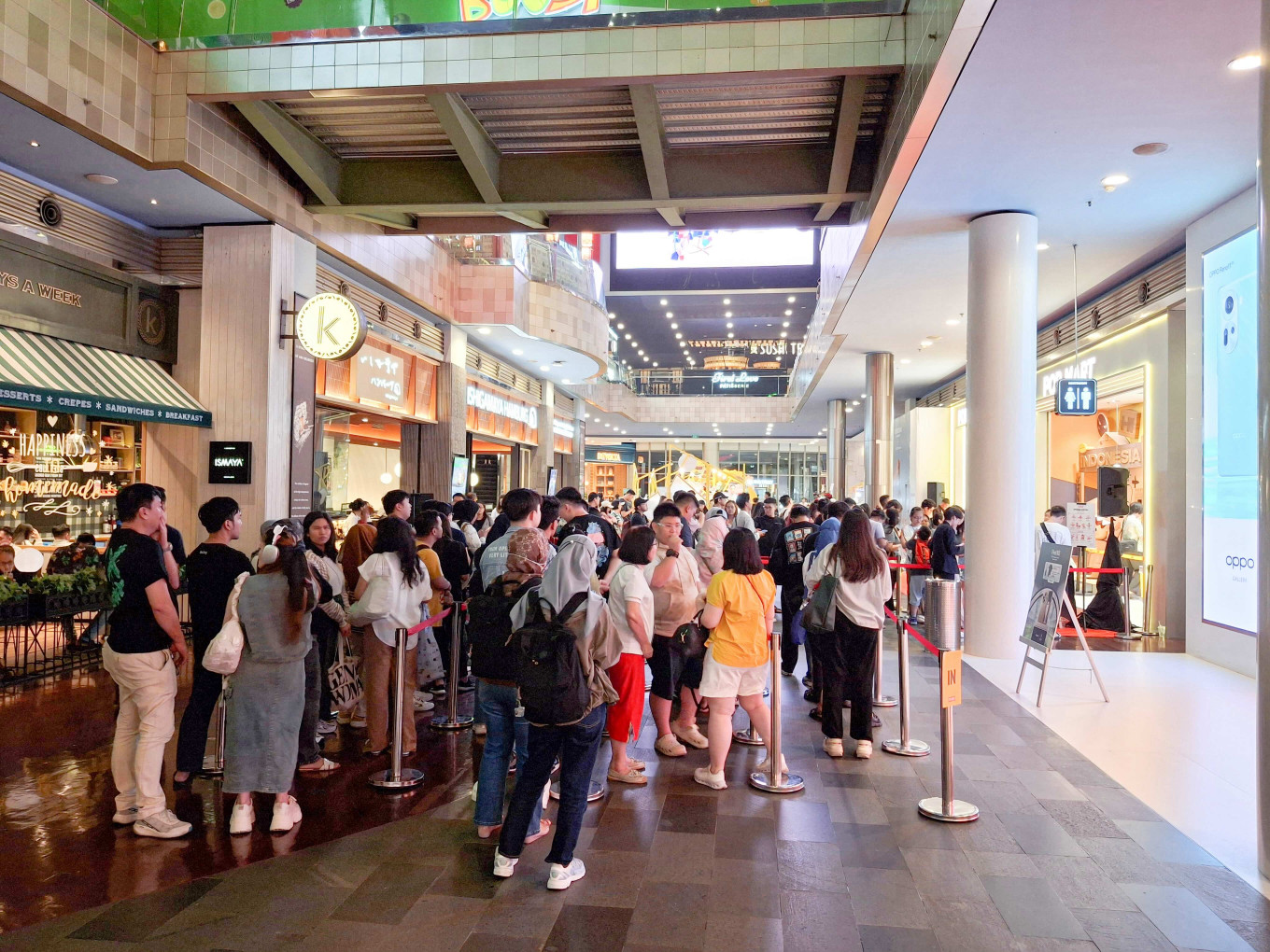 Customers queue for the vinyl plush toys from Labubu, made popular by BLACKPINK's Lisa, at Pop Mart in South Jakarta in this file photograph.
