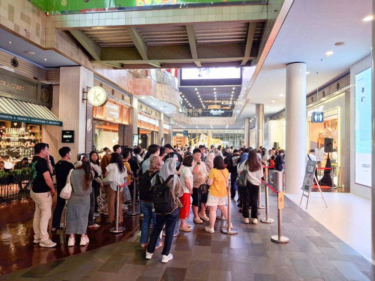 Customers queue for the vinyl plush toys from Labubu, made popular by BLACKPINK's Lisa, at Pop Mart in South Jakarta.