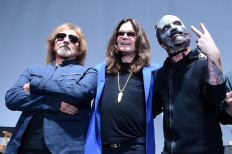 Ozzy Osbourne (center) and Geezer Butler (left) of Black Sabbath pose with Corey Taylor (right) of Slipknot on May 12, 2016 in Los Angeles, California, where the bands announced they will team up for the Ozzfest meets Knotfest concert in September in San Bernadino, California. 