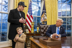 Tesla and SpaceX CEO Elon Musk with his son X Æ A-Xii join US President Donald Trump as he signs executive orders in the Oval Office of the White House in Washington, DC, February 11, 2025. Tech billionaire Elon Musk, who has been tapped by President Donald Trump to lead federal cost-cutting efforts, said the United States would go “bankrupt“ without budget cuts. Musk leads the efforts under the newly created Department of Government Efficiency (DOGE), and was speaking at the White House with Trump, who has in recent weeks unleashed a flurry of orders aimed at slashing federal spending.
