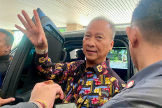 Industry Minister Agus Gumiwang Kartasasmita gestures on Jan. 7, 2025, while speaking to reporters in front of his offices in Setiabudi, South Jakarta.
