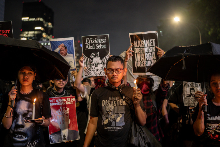 Protesters take part in a demonstration against President Prabowo Subianto's administration in front of a police barricade near the Presidential Palace in Central Jakarta on Feb. 21, 2025. 