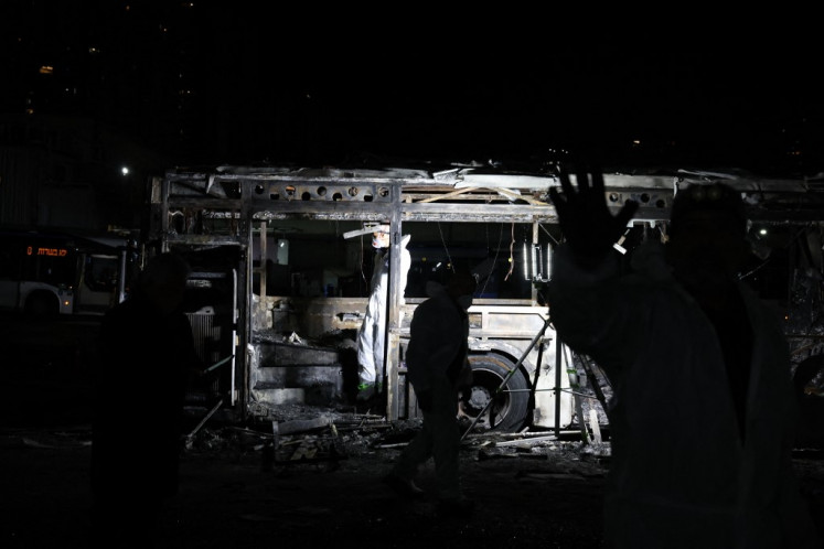 Security forces and bomb disposal units are deployed to the scene of a bus explosion in Bat Yam, Israel on Feb. 20, 2025. Israeli police said that bombs on three buses exploded in the central city of Bat Yam on Feb.  20 evening, with a local official saying there were no injuries.