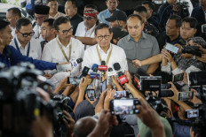 Jakarta Governor Pramono Anung speaks to the media upon his arrival to join the ongoing week-long regional heads’ retreat at the Military Academy in Magelang, Central Java, on Feb. 24, 2025.
