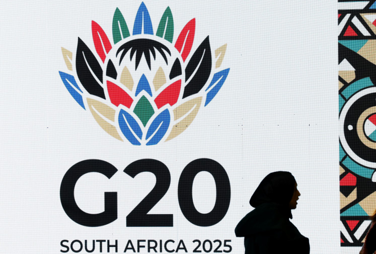 A guest is seen next to a display during a meeting of the G20 foreign ministers, which is hosted by South Africa, under the theme “Solidarity, Equality and Sustainability“, at the NASREC conference centre in Johannesburg, South Africa, on February 20, 2025. 