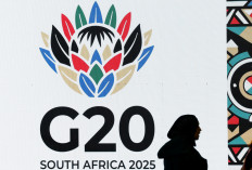 A guest is seen next to a display during a meeting of the G20 foreign ministers, which is hosted by South Africa, under the theme “Solidarity, Equality and Sustainability“, at the NASREC conference centre in Johannesburg, South Africa, on February 20, 2025. 