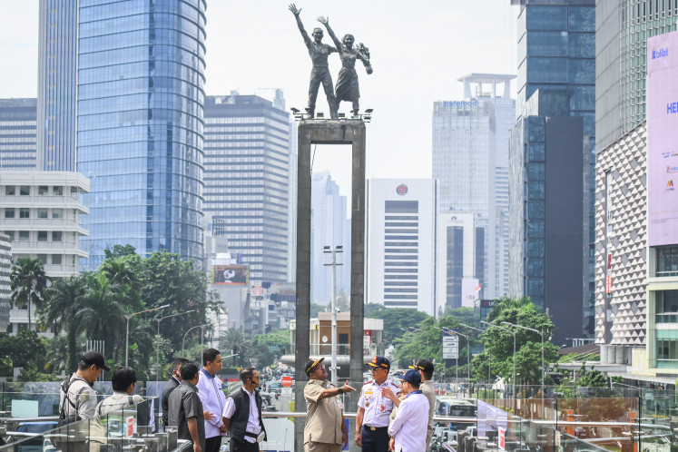 Jakarta Deputy Governor Rano Karno (fourth right) inspects the Skydeck of the Transjakarta bus stop at the HI Roundabout on Feb. 25 in Central Jakarta.