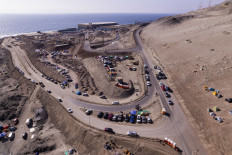 This aerial view shows workers from the Escondida copper mine setting up a camp during a strike after failing to reach a labor agreement with Australian group BHP, in Puerto Coloso, Antofagasta, Chile, on August 14, 2024.