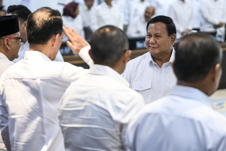 President Prabowo Subianto greets Red and White Cabinet members ahead of a plenary cabinet meeting at the Presidential Office in Jakarta on Jan. 22, 2025. 