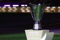 The Qatar 2023 AFC Asian Cup trophy is presented on the pitch before the start of the final football match between Jordan and Qatar at the Lusail Stadium in Lusail, north of Doha, Qatar on Feb. 10, 2024.