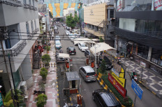 Melting pot: Several cars enter the Blok M Square complex in South Jakarta on Feb. 22, 2025. The Blok M area has been known as a hub for people from all walks of life to meet and spend time on the weekends since the 1970s.