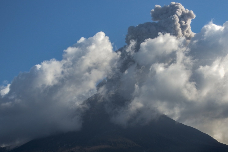 Mount Lewotobi Laki-Laki spews volcanic ash during an eruption as seen from Nobo Village in East Flores, East Nusa Tenggara on March 1, 2025.