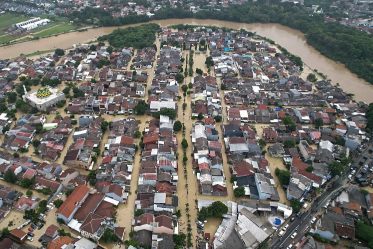 This handout picture taken and released on March 4, 2025 by the National Disaster Mitigation Agency shows buildings inundated by floodwaters in Bekasi, West Java. 