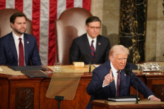Trump takes victory lap in speech to Congress, Democrats protest