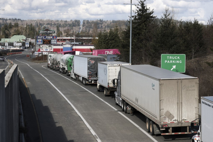 Trucks traveling into Canada are pictured at the Pacific Highway US-Canadian border crossing in Blaine, US, on March 5, 2025.