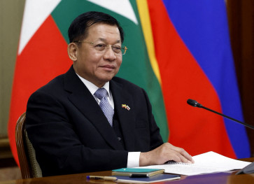 Then Myanmar's military chief Senior General Min Aung Hlaing attends a meeting with Russia's Prime Minister Mikhail Mishustin in Moscow, Russia, on March 4, 2025.