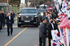 South Korean impeached president Yoon Suk Yeol walks outside the Seoul detention center after his release in Uiwang, South Korea, on March 8, 2025.
