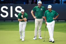 Boston Commons team members (from left) Rory McIlroy, Keegan Bradley and Hideki Matsuyama gesture as they participate in the inaugural TGL golf league in Florida, the United States, in this undated photo file.