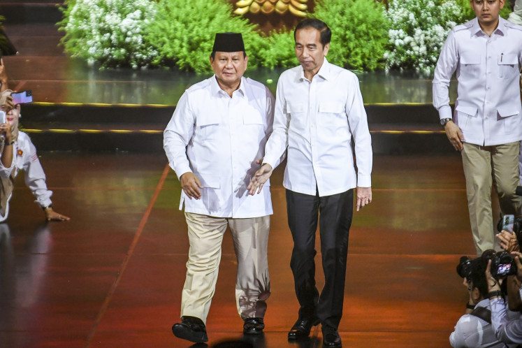 Gerindra Party chair President Prabowo Subianto (left) walks along with former president Joko “Jokowi“ Widodo (second right) during the celebration ceremony of the party's 17th anniversary at Sentul International Convention Center in Bogor, West Java on Feb. 15, 2025.