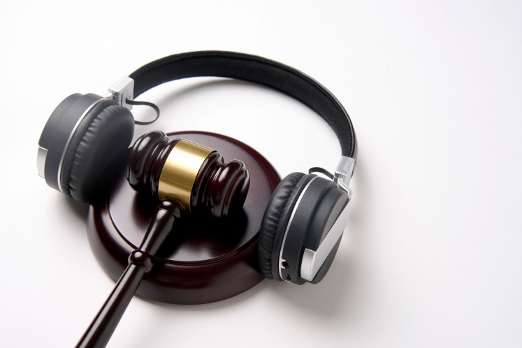 A creative illustration depicting music copyright law.