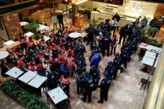 Demonstrators from the human rights organization Jewish Voice for Peace are detained by NYPD officers as they hold a civil disobedience action inside Trump Tower in New York on March 13, 2025. 