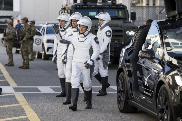 In this NASA handout, (from left to right) Roscosmos cosmonaut Kirill Peskov; NASA astronauts Nichole Ayers and Anne McClain; and Japan Aerospace Exploration Agency (JAXA) astronaut Takuya Onishi, all wearing SpaceX spacesuits, are seen as they prepare to depart the Neil A. Armstrong Operations and Checkout Building for Launch Complex 39A on NASA's Kennedy Space Center to board the SpaceX Dragon spacecraft for the Crew-10 mission launch, Wednesday, on March 12, 2025, at NASA's Kennedy Space Center in Cape Canaveral, Florida, the United States. NASA's SpaceX Crew-10 mission is the tenth crew rotation mission of the SpaceX Crew Dragon spacecraft and Falcon 9 rocket to the ISS as part of the agency's Commercial Crew Program.