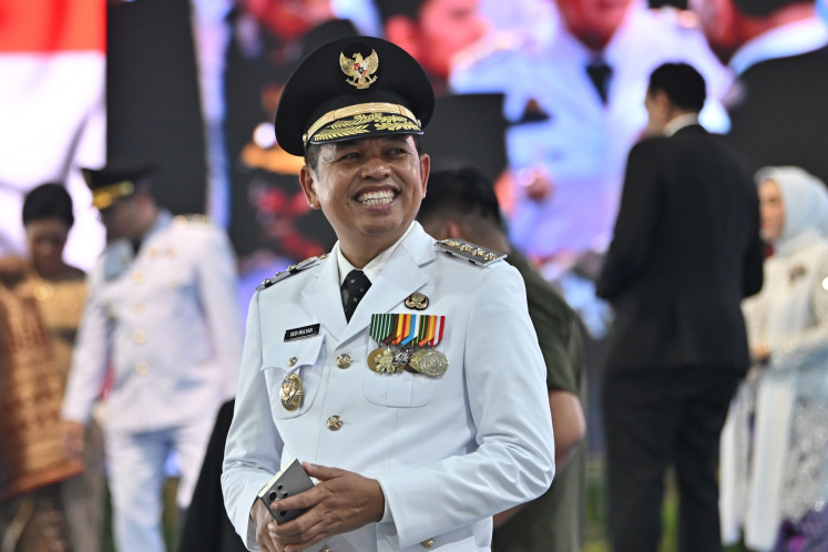 West Java Governor Dedi Mulyadi smiles on Feb. 20, 2025, following the mass inauguration of 961 governors, mayors, regents and their deputies at the presidential palace complex in Jakarta.