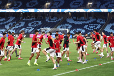 Indonesian players stretch during a training session at Allianz Stadium in Sydney on March 19, 2025, ahead of the 2026 FIFA World Cup Asian qualification football match between Indonesia and Australia.