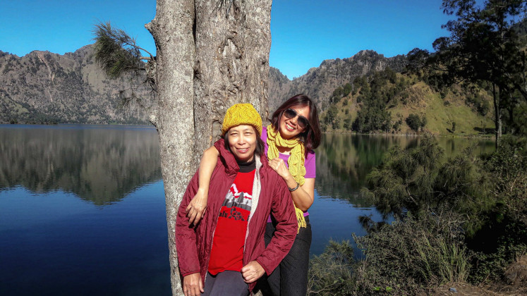 Lilie and her best friend, Elsa Laksono, pose together at Lake Segara Anak, Mount Rinjani, Lombok, West Nusa Tenggara, in May 2018.