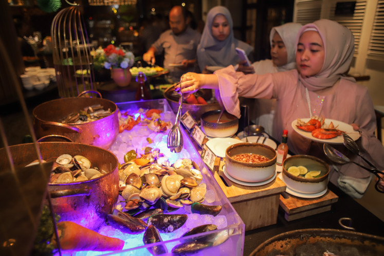 Celebration: Visitors take iftar dishes prepared at the DoubleTree by Hilton Surabaya in East Java on March 6, 2025.