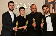 Israeli journalist and filmmaker Yuval Abraham, US producer Rachel Szor, Palestinian filmmaker Hamdan Ballal, Palestinian journalist and filmmaker Basel Adra (left to right) pose in the press room with the Oscar for Best Documentary Feature for “No Other Land“ during the 97th Annual Academy Awards at the Dolby Theatre in Hollywood, California on March 2, 2025.