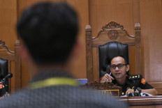 Lt. Col. Arif Rachman (‘right'), the presiding judge in the trial against three Indonesian Navy officers in the case of murder of a car rental owner and car theft, questions a witness at the Jakarta Military Court in East Jakarta on Feb. 24, 2025.