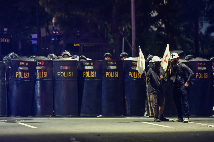 Police officers form a line on March 20, 2025, during a protest against the revision of the Indonesian Military (TNI) Law in Jakarta.