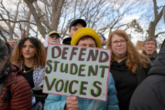 Demonstrators take part in the Stand with Rumeysa Ozturk, Tufts PHD Student emergency rally, at Powder House Square Park, after Ozturk was taken into custody by federal agents, in Somerville, Massachusetts, US. March 26, 2025. 