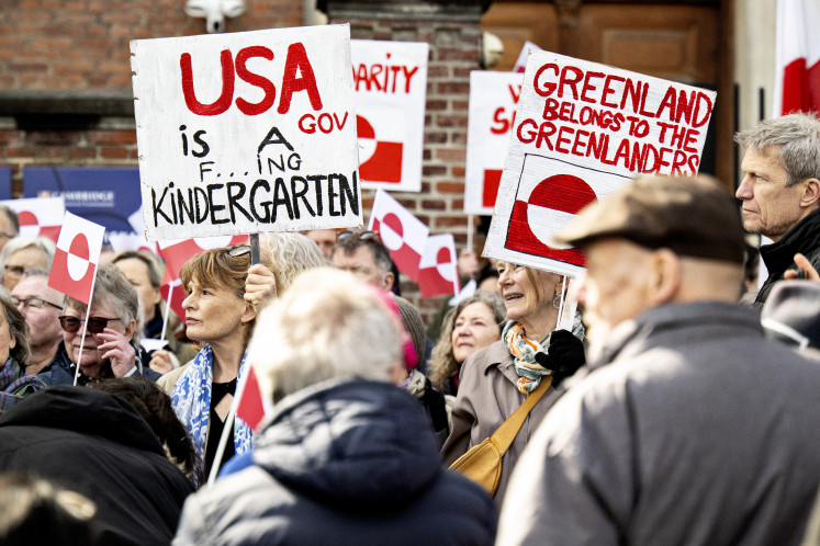People protest against United States pressure on Greenland and Denmark, in front of the US Embassy in Copenhagen on March 29, 2025. 