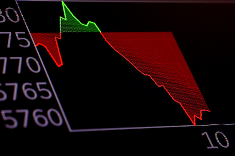 A stock chart is displayed on a screen on the floor at the New York Stock Exchange (NYSE) in New York City, US, on March 26, 2025.
