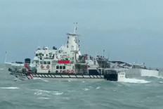 A Taiwan Coast Guard ship (front) and a Chinese Coast Guard ship (back) sail on April 1 in waters off the Matsu Islands in Taiwan.