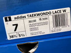 A tag on an Adidas shoe box indicates it was manufactured in Vietnam on April 04, 2025 in Miami, Florida. 