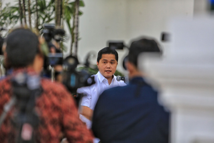State-Owned Enterprises Minister Erick Thohir (center) is pictured in an undated photograph.