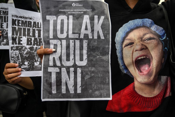 Crying out: Students display placards reading “Return the soldiers to the barracks“ during a protest on March 24 against a revision to the Indonesian Military (TNI) Law in Surabaya, East Java.