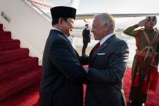 Jordan's King Abdullah II (right) receives President Prabowo Subianto at Marka Air Force Base near Amman on April 13.