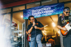 Dual commitment: Usman Hamid, best known as the executive director of human rights group Amnesty International Indonesia, belts out a tune he wrote for his band Usman and the Blackstones during an event to celebrate International Record Store Day in South Tangerang on April 13, 2025.