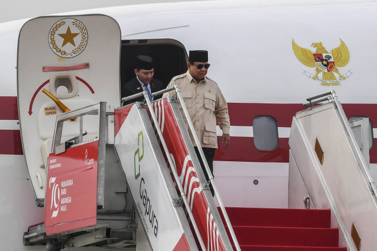 President Prabowo Subianto gets off the presidential plane after landing at the Halim Perdanakusuma Air Force Base in Jakarta on April 15, 2025, following his foreign visits to five Middle Eastern countries to discuss about various issues with their respective leaders.