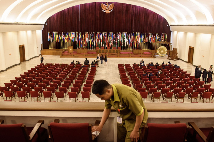 Historic venue: A worker cleans chairs at the main hall of the Merdeka Building on April 16 in Bandung, West Java. The building was the site of the 1955 Asia-Africa Conference, also known as the Bandung Conference, where 29 Asian and African countries convened in the spirit of anti-colonialism.