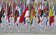 A military honor guard leads the parade with various flags of participating countries on April 24, 2015, during ceremonies marking the 60th anniversary of the Asian-African Conference in Bandung, West Java. 