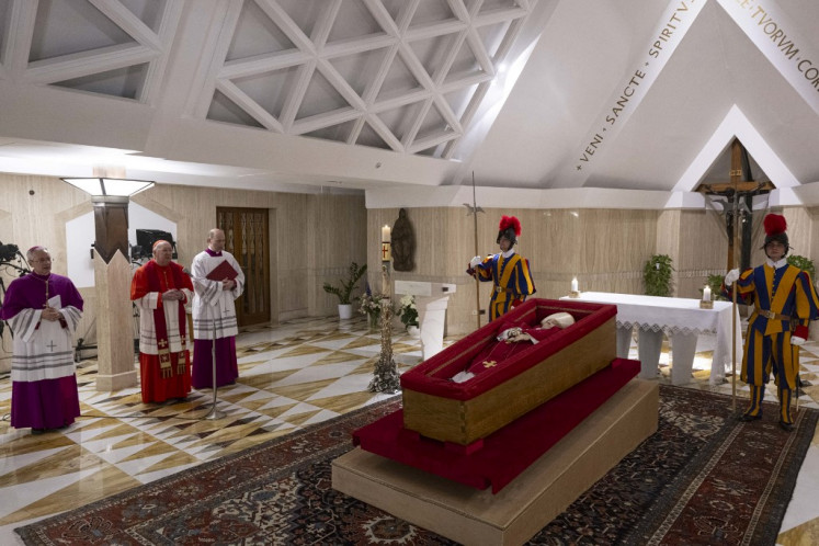 This photo taken on April 21, 2025 and handout on April 22, 2025 by The Vatican Media shows Pope Francis in his open coffin in The Vatican. 