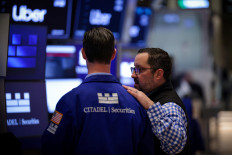 Traders work on the floor at the New York Stock Exchange (NYSE) in New York City, US, on April 24, 2025.